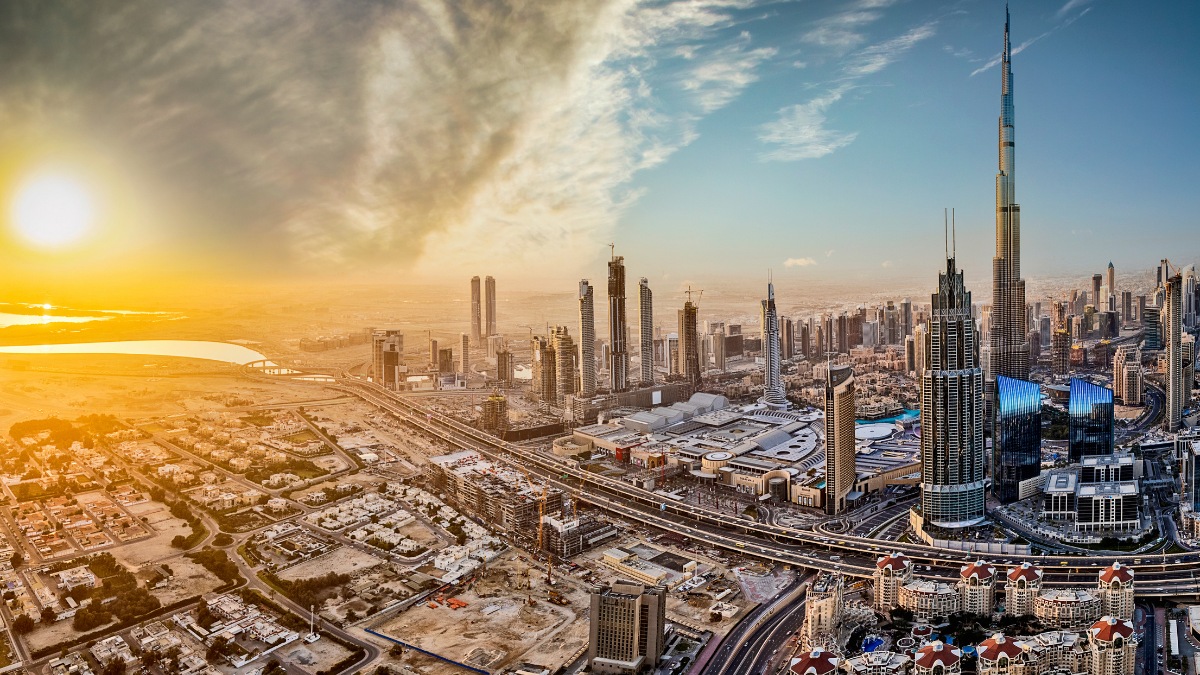Aerial view of Dubai's skyline and Burj Khalifa at sunset